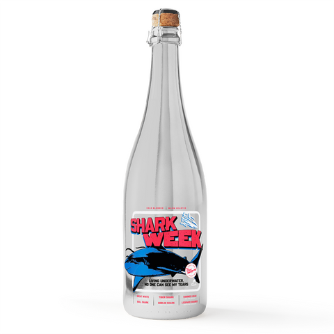 Silver metallic bubbly wine bottle with Shark Week design on Mano's Wine bottle