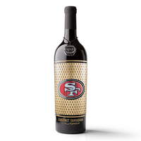 An etched Cabernet Sauvignon wine bottle with the San Francisco 49ers team logo from Mano's Wine