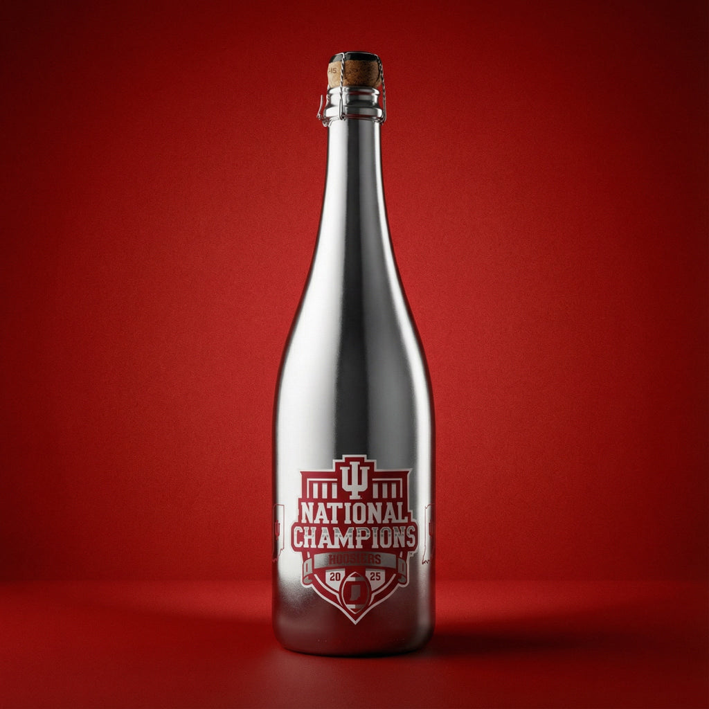 Silver wine bottle with red Indiana University National Champions label on a red background
