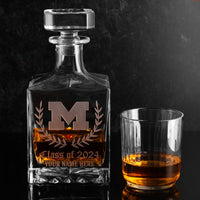 Customizable glass decanter with University of Michigan logo etched into the glass filled with bourbon whiskey