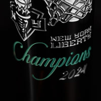 New York Liberty team logo, 2024 Champions etched on a Mano's Wine bottle