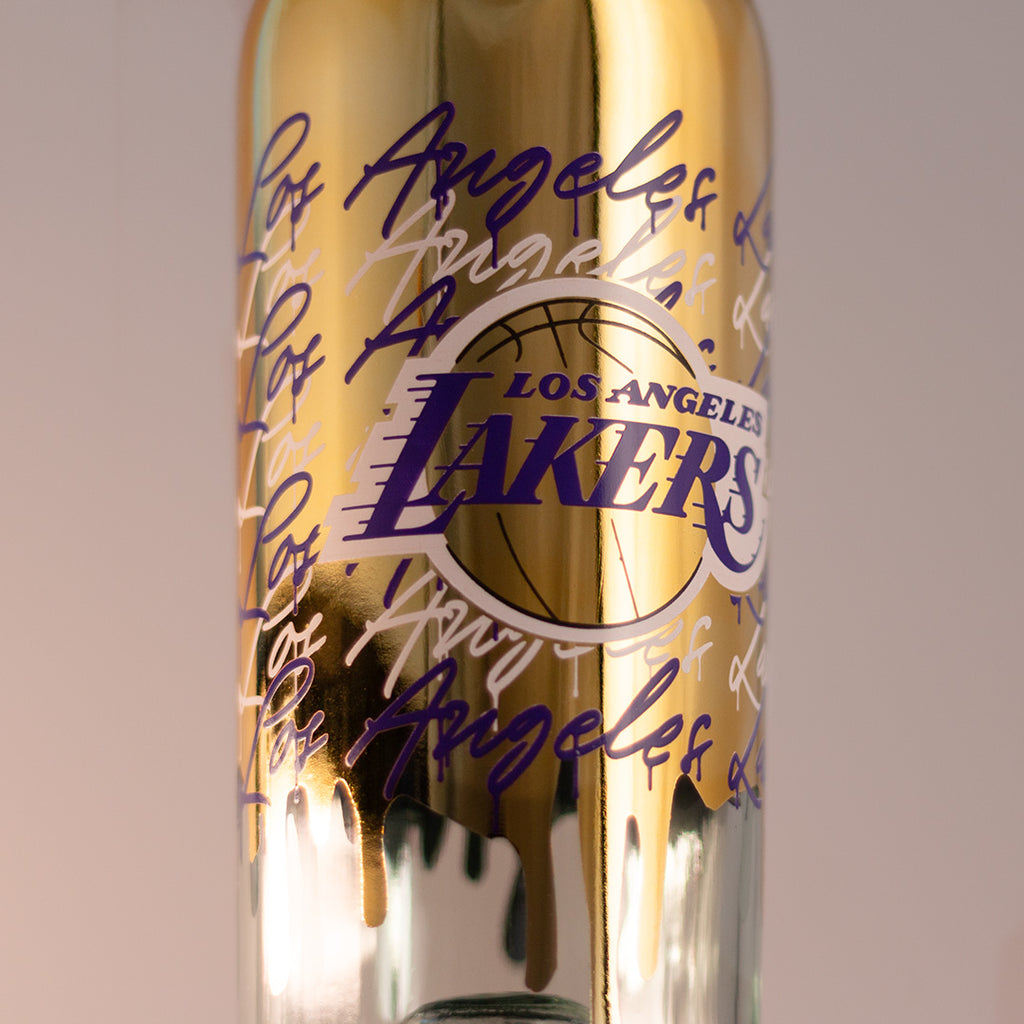 Close up of Los Angeles Lakers gold drip display basketball wine bottle from Mano's Wine