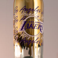 Close up of Los Angeles Lakers gold drip display basketball wine bottle from Mano's Wine