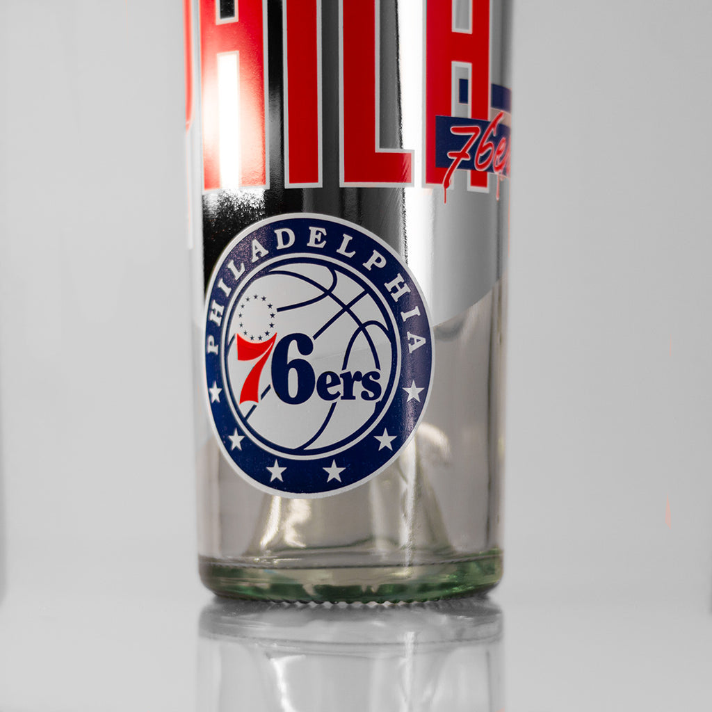 Close up of Philadelphia 76ers Specialty Metallic Display Basketball Wine Bottle