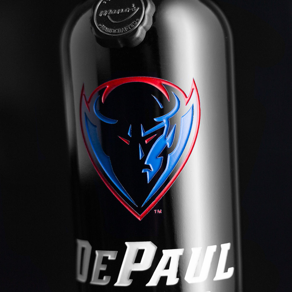 Close up view of DePaul University Blue Demons logo etched on Mano's Wine bottle