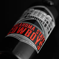 Mano's Wine bottle etched with Boone Pickens Stadium and Oklahoma State Cowboys in orange text