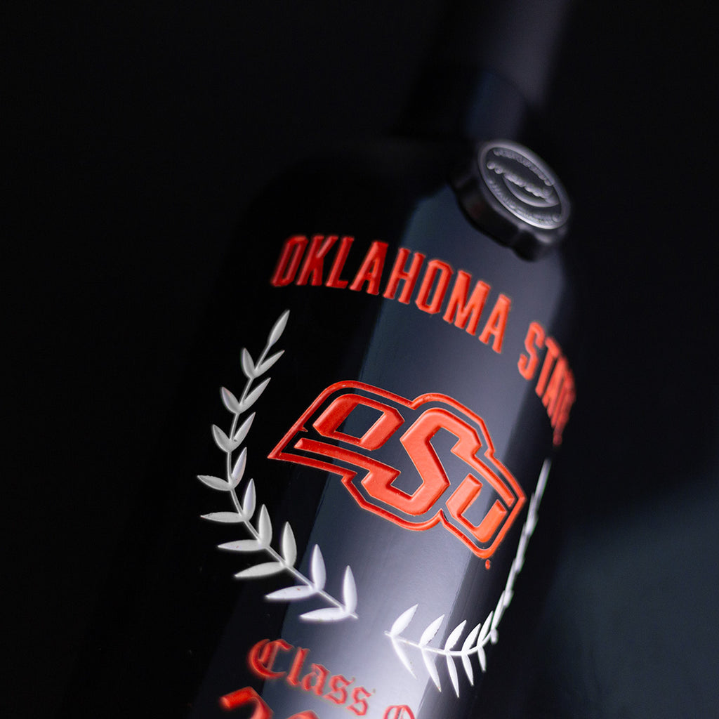 Oklahoma State and OSU etched in orange on the Oklahoma State Custom Alumni Etched Wine bottle