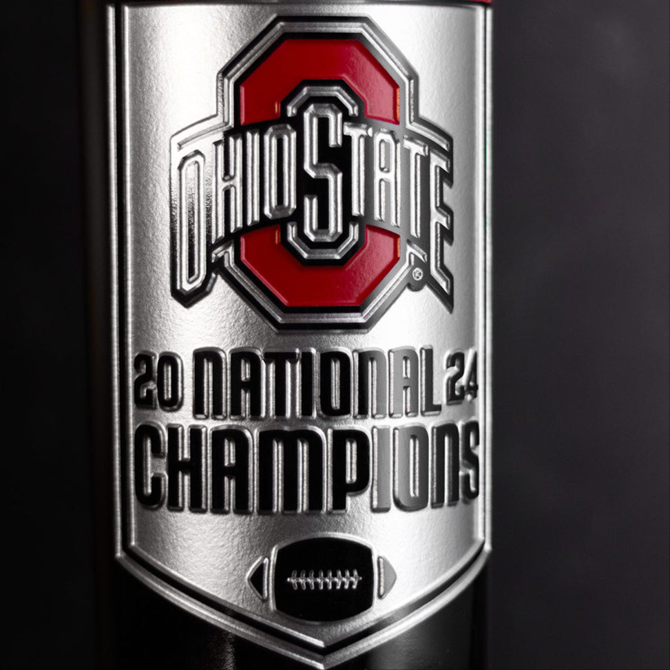 Ohio State University logo, 2024 National Champions and football etched on Mano's Wine bottle