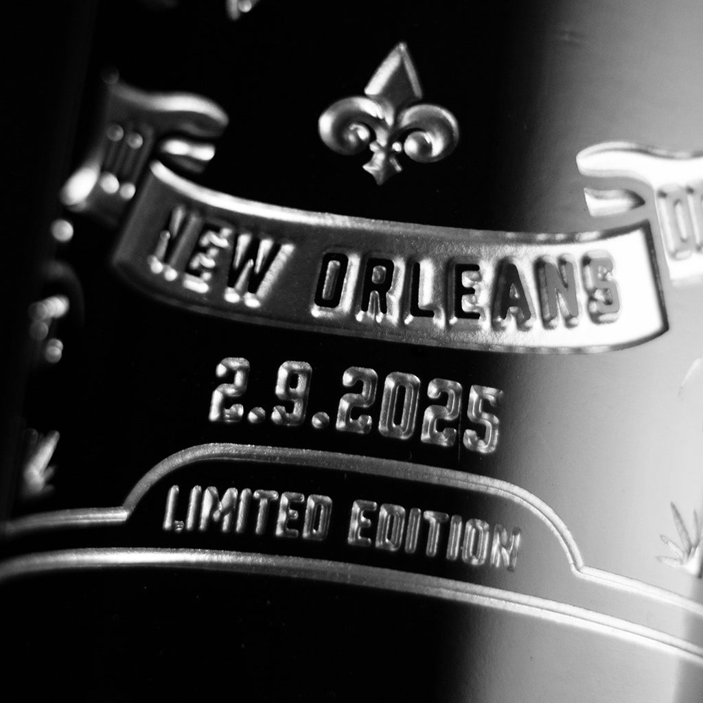 Close up look of Philadelphia Eagles etched wine bottle with text: New Orleans, 2.9.2025, and Limited Edition