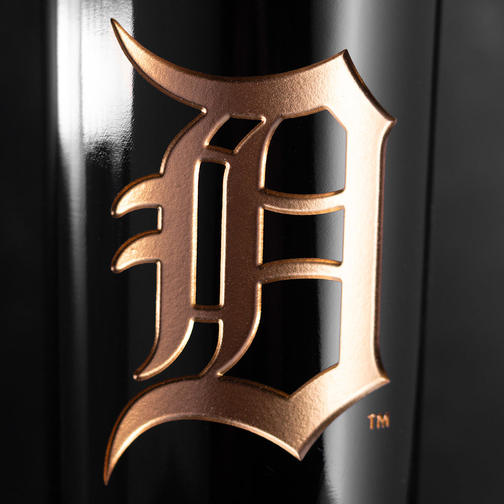 Close up image of Detroit Tigers etched in gold on a Mano's Wine bottle