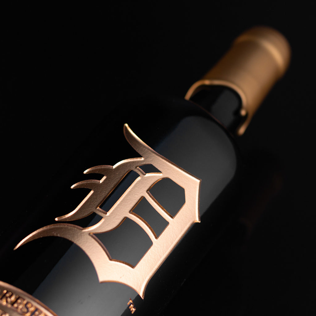 Gold Detroit Tigers logo etched on wine bottle dipped in gold wax