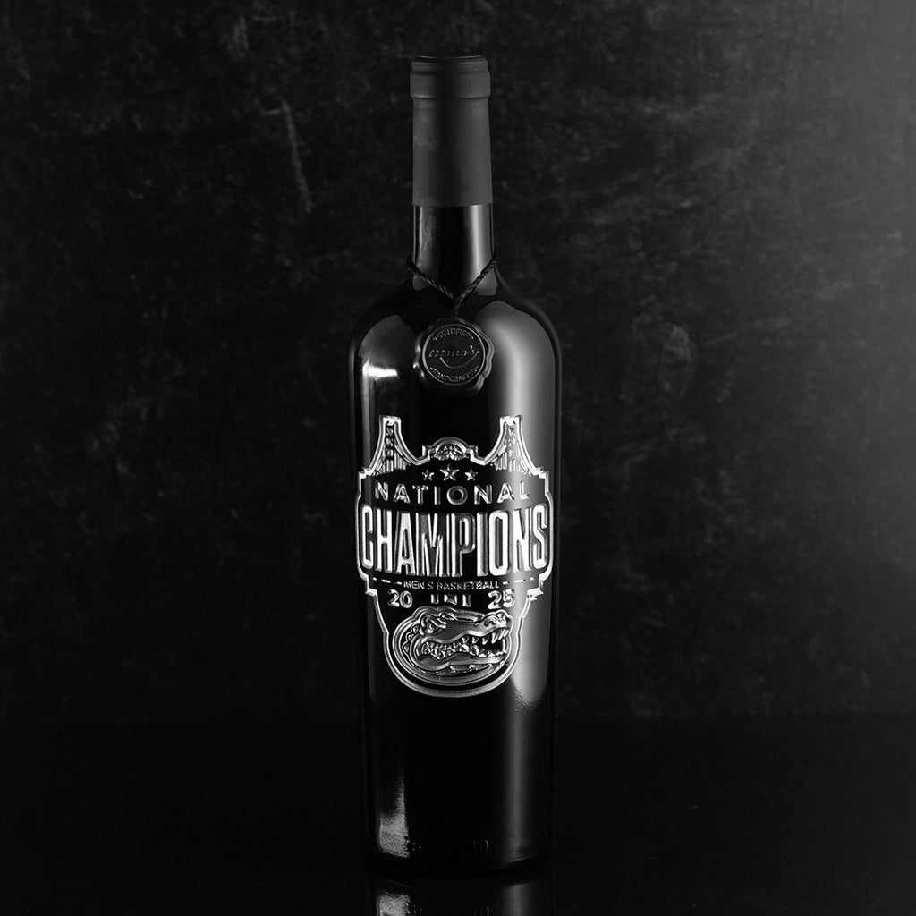Mano's Wine etched bottle featuring silver University of Florida Gators logo and text 2025 National Basketball Champions