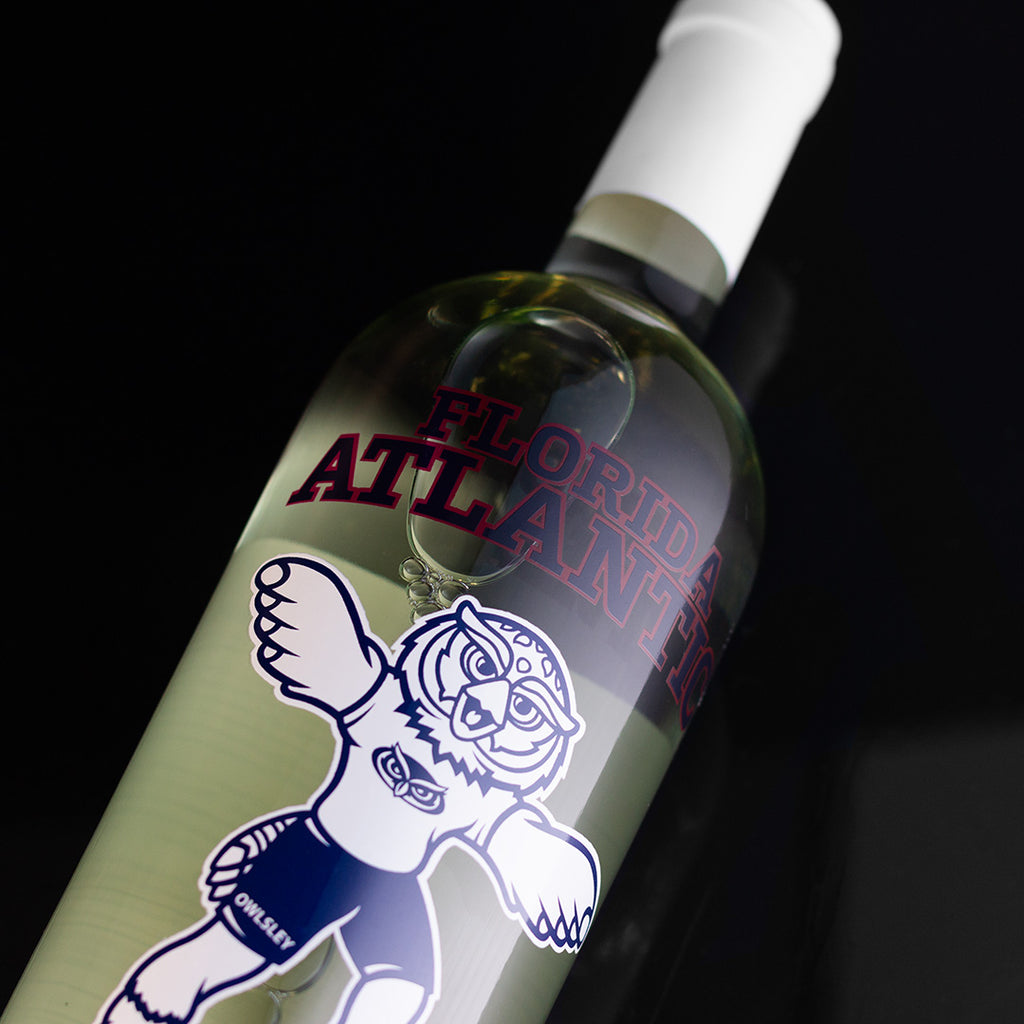 Close up of Owlsley Florida Atlantic University mascot on a Mano's Wine sauvignon blanc bottle