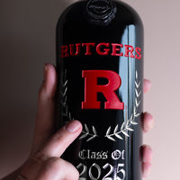 Mano's Wine etched bottle featuring red Rutgers R and custom name and graduating class