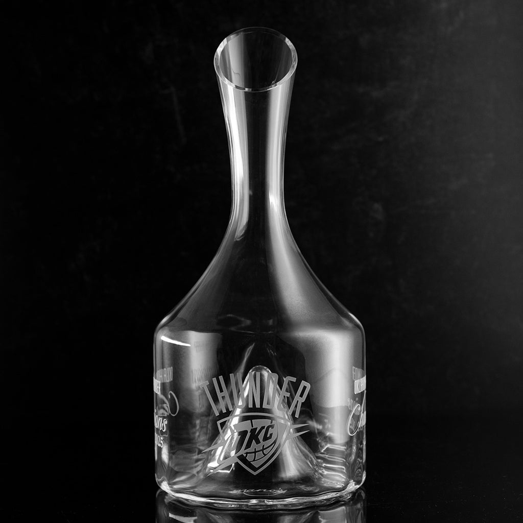 Clear glass decanter etched with OKC Thunder team logo celebrating their 2025 championship win
