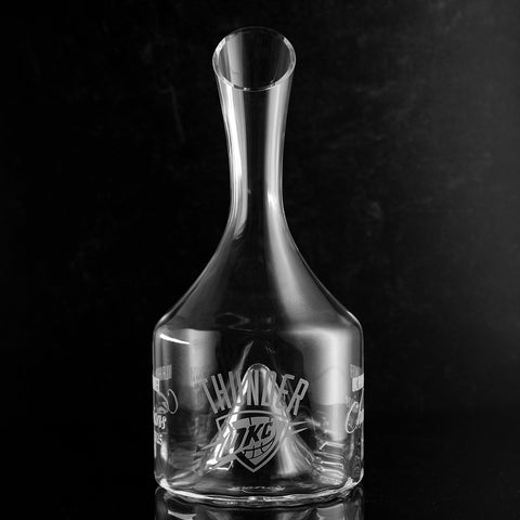 Clear glass decanter etched with OKC Thunder team logo celebrating their 2025 championship win