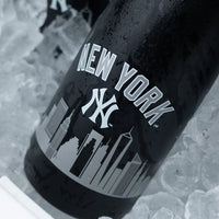 Mano's Wine bottle of New York Yankees bubbly wine being pulled out from the ice in a cooler