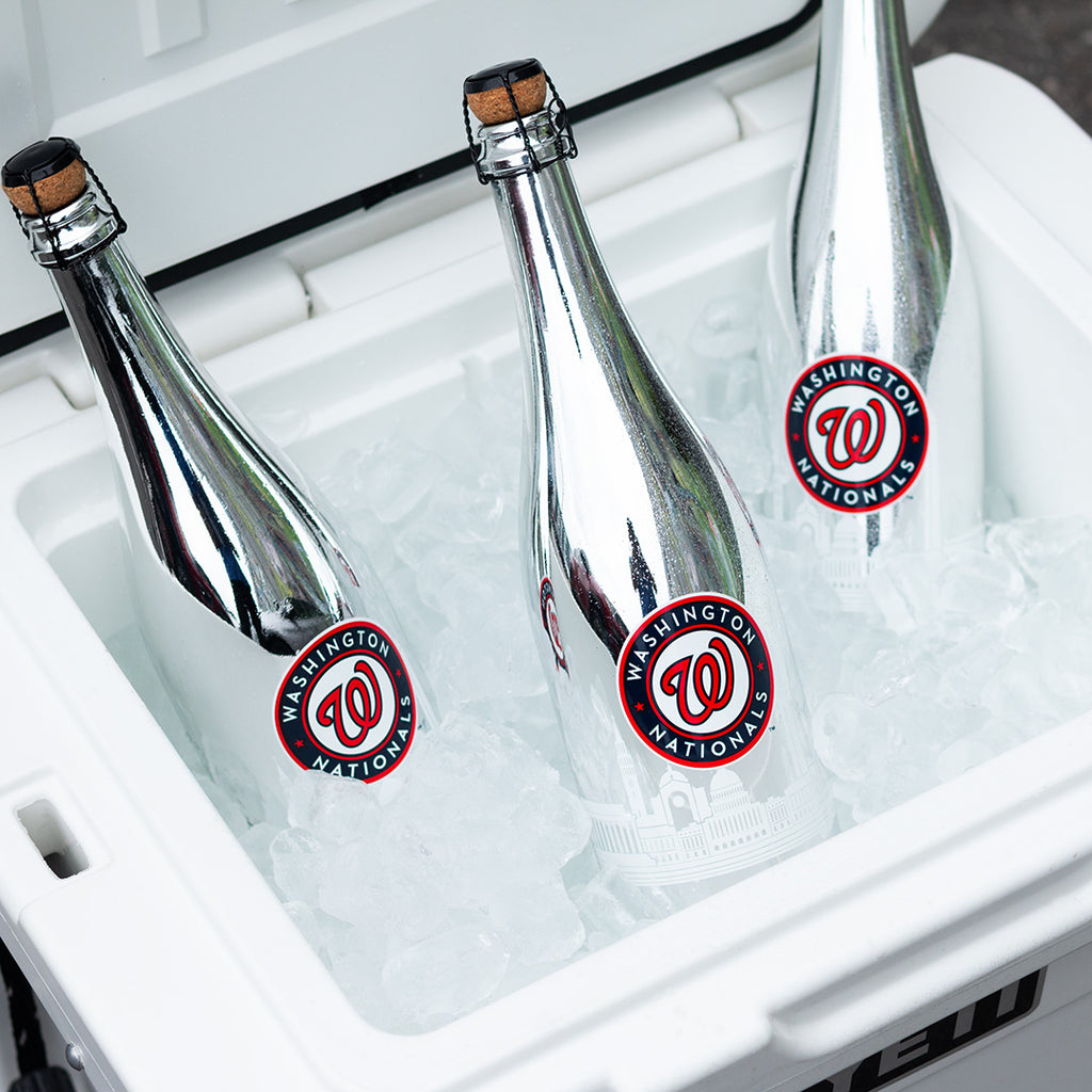 Three metallic silver Mano's Wine bottles of Washington Nationals bubbly wines in a YETI cooler