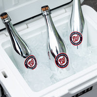 Three metallic silver Mano's Wine bottles of Washington Nationals bubbly wines in a YETI cooler