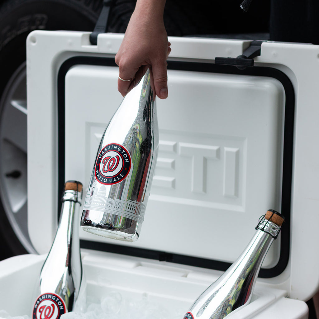 Mano's Wine bottle of Washington Nationals bubbly wine being pulled out from the ice in a cooler