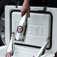 Mano's Wine bottle of Washington Nationals bubbly wine being pulled out from the ice in a cooler