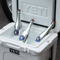 Three metallic silver Mano's Wine bottles of Houston Astros bubbly wines in a YETI cooler