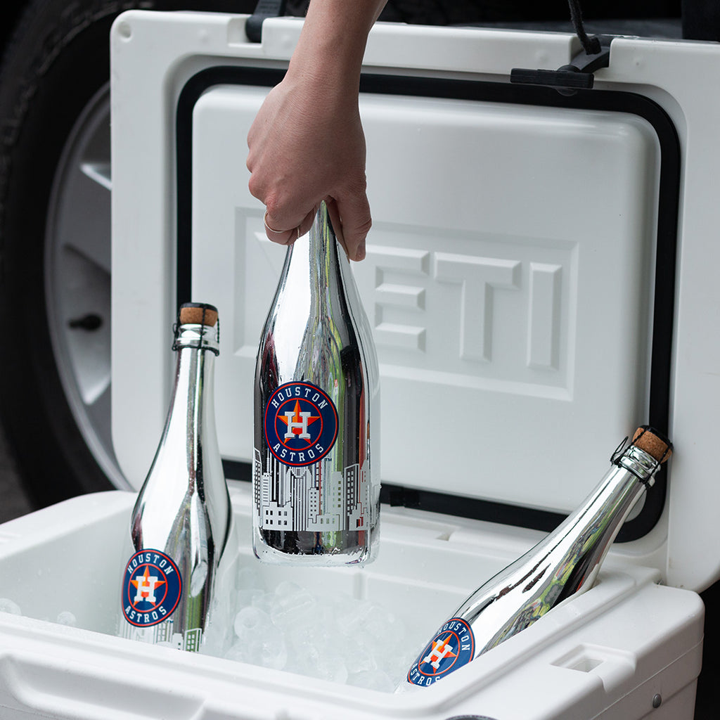 Mano's Wine bottle of Houston Astros bubbly wine being pulled out from the ice in a cooler