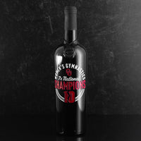 Mano's Wine bottle with OU Oklahoma University logo with text: "Women's Gymnastics 7x National Champions"