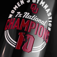 Close up of the University of Oklahoma Women's Gymnastics 7x National Champions Etched Wine bottle from Mano's Wine