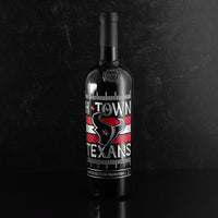 Mano's Wine cabernet sauvignon bottle etched with Houston Texans logo and "H-TOWN TEXANS" text