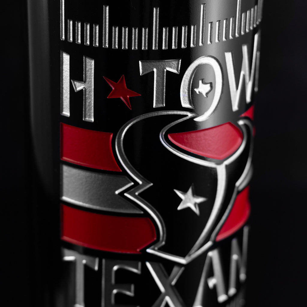 Close-up of a Houston Texans logo etched on a bottle of cabernet sauvignon from Mano's Wine