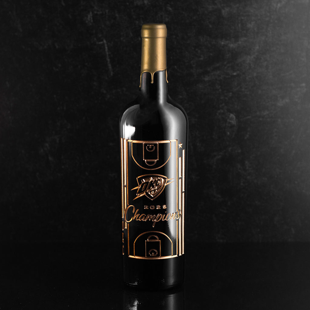 Mano's Wine bottle etched with OKC Thunder logo, basketball court and 2025 Champions