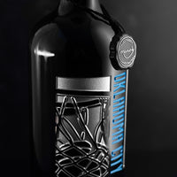 Close up of silver net and basketball hoop etched on OKC Thunder wine bottle from Mano's Wine