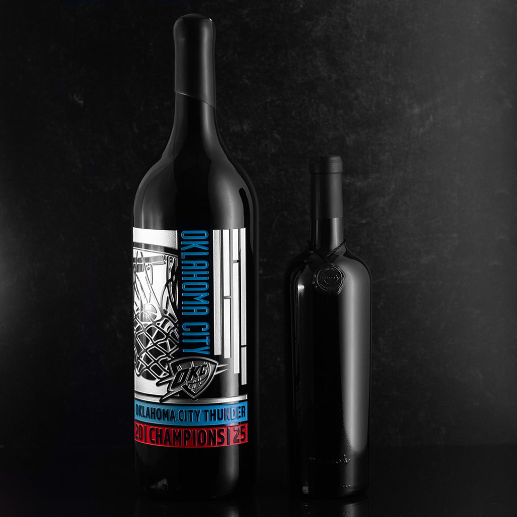 Black bottle etched with Oklahoma City Thunder logo, team name, basketball net and 2025 champions text
