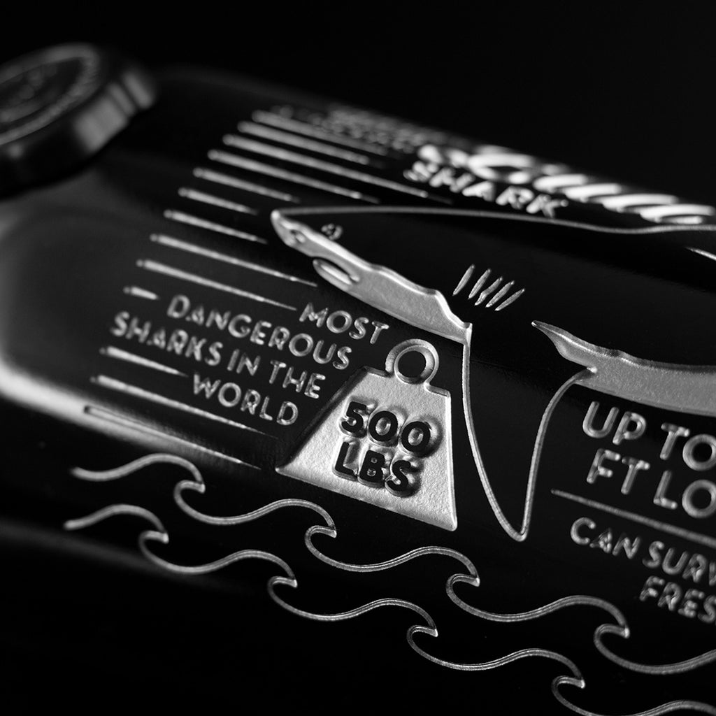 Close up of Mano's Wine Bull Shark Facts Etched Wine Bottle with text "most dangerous sharks in the world"