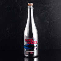 Mano's Wine silver bottle with Shark Week design on the bottle with a black background
