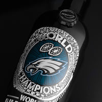 Philadelphia Eagles wine bottle etched with silver ring with 2024 World Champions emblem from Mano's Wine