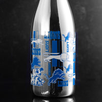 Close up view of the Detroit Lions Logo Evolution Metallic Silver Bubbly wine bottle from Mano's Wine