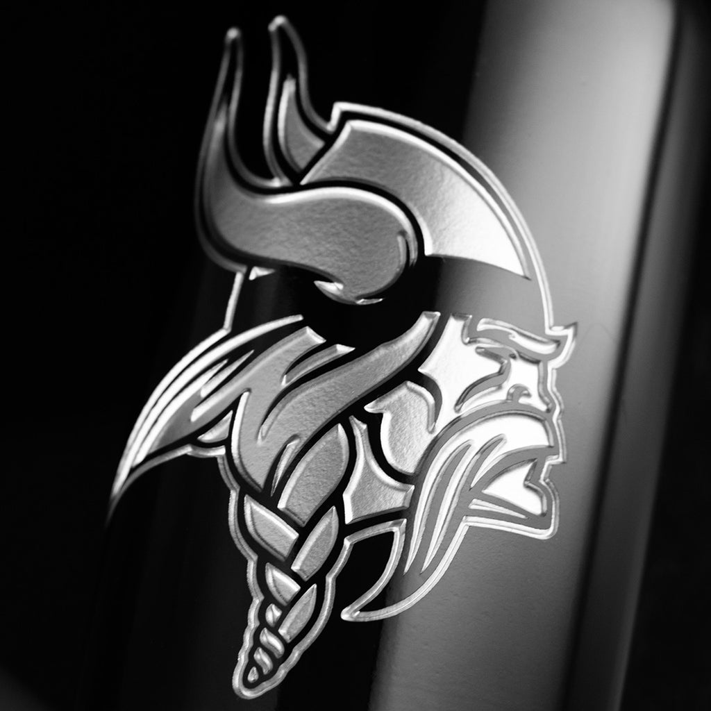 Close up of the Minnesota Vikings logo etched on a Mano's Wine cabernet sauvignon bottle