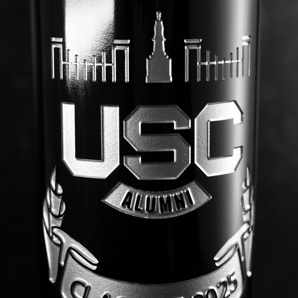 Close up view of wine bottle etched with the University of South Carolina alumni association