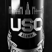 Close up view of wine bottle etched with the University of South Carolina alumni association