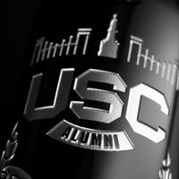 Close up look at cabernet sauvignon wine bottle etched with University of South Carolina alumni graduate name and graduating year