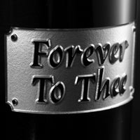 Forever To Thee motto etched on University of South Carolina alumni wine bottle from Mano's Wine