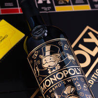 Close up image of Monopoly Mano's Wine golden etched bottle
