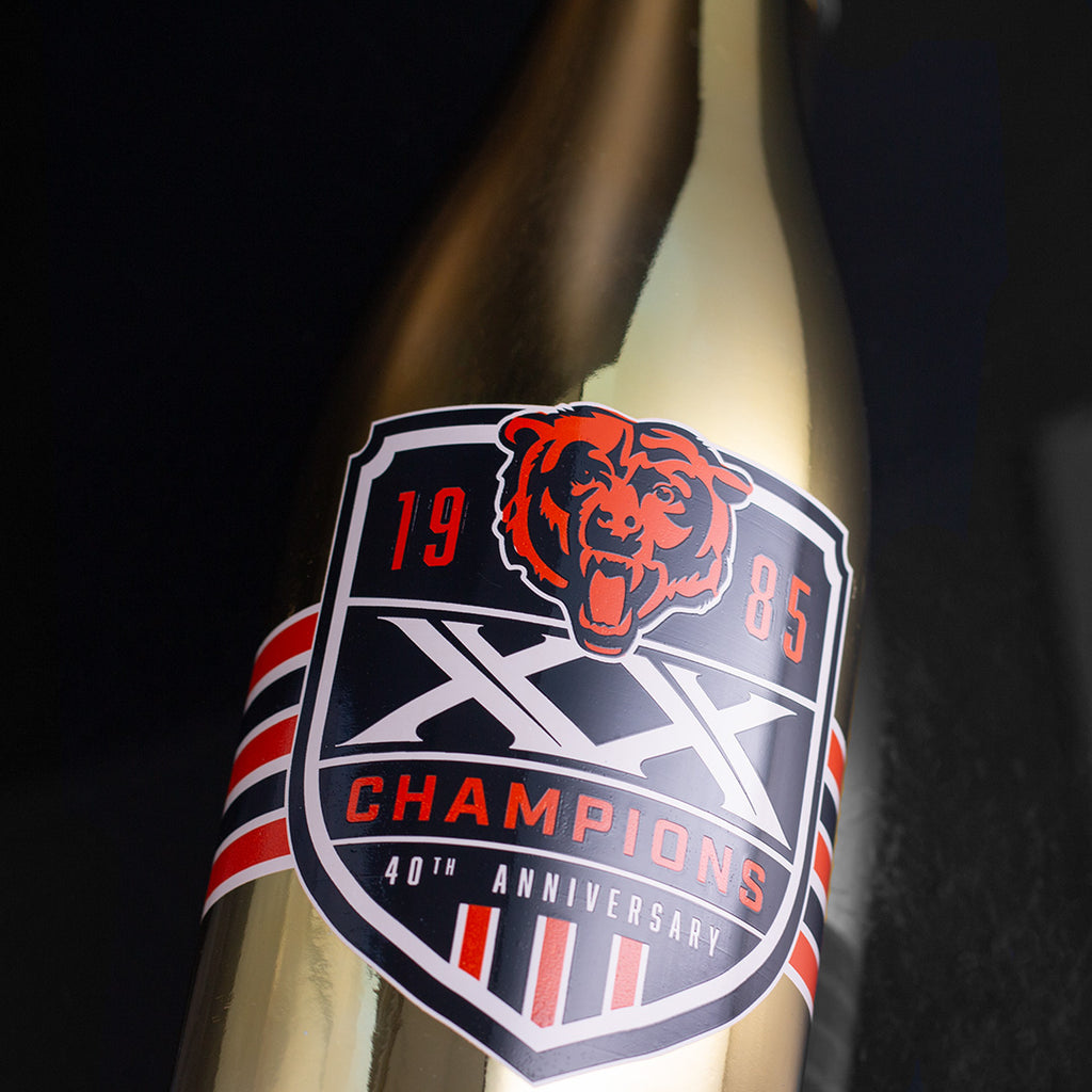 Close up view of bubbly wine bottle with the 40th anniversary of the 1985 Chicago Bears championship team