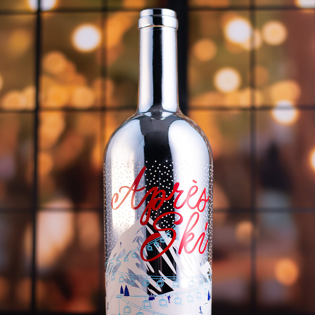 Silver bottle labeled 'Après Ski' Mano's Wine