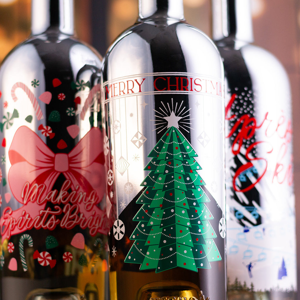 Decorative wine bottles with Christmas-themed bottle designs.