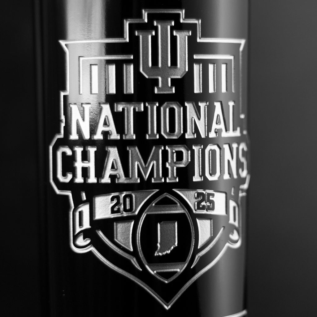 Indiana University National Champions 2025 football state of Indiana etched in silver on Mano's Wine championship bottle
