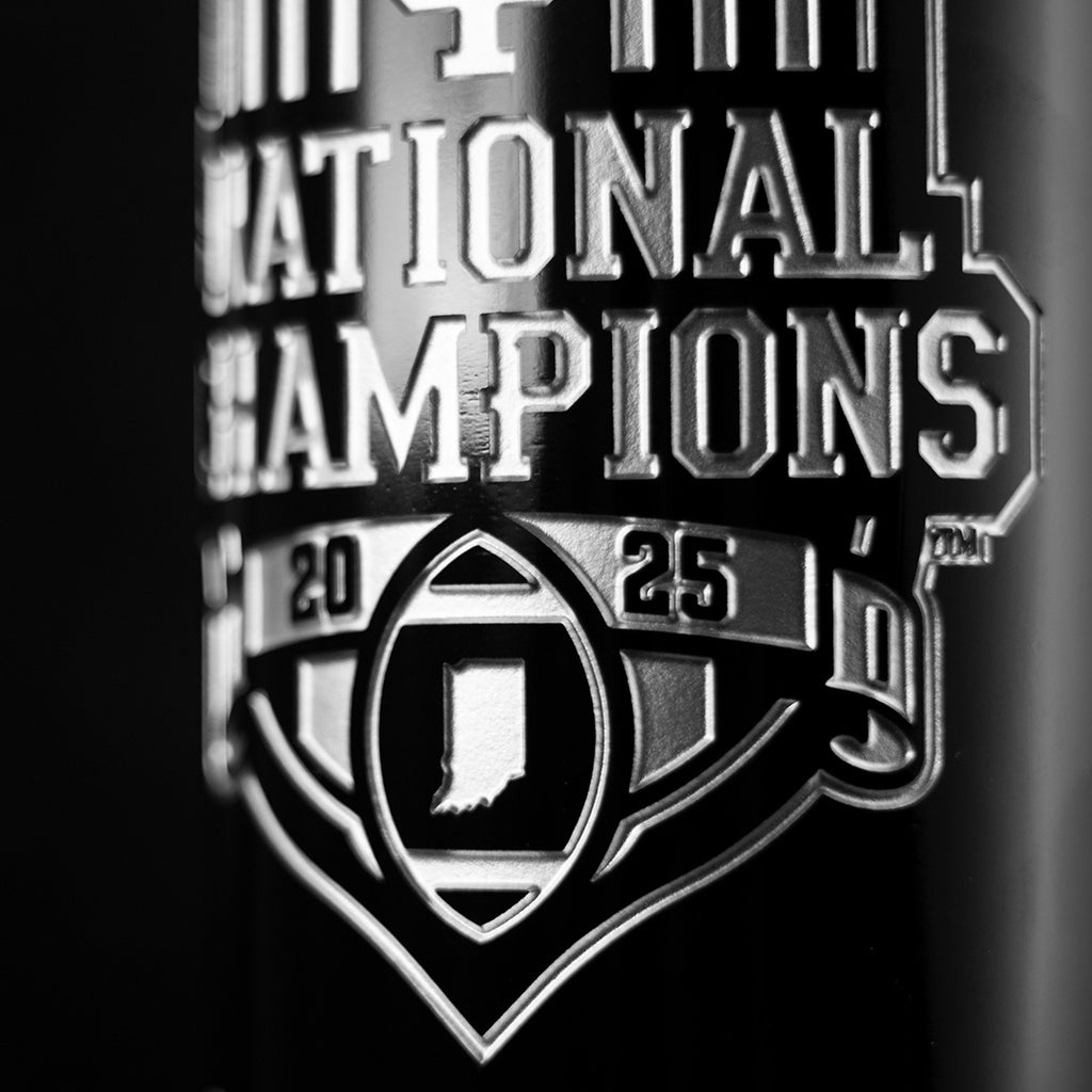 Close up view of Indiana University 2025 National Champions etched wine bottle with football and state of Indiana