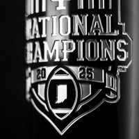 Close up view of Indiana University 2025 National Champions etched wine bottle with football and state of Indiana
